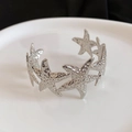 Detailed view of silver starfish cuff bracelet featuring textured metal and hollow design - Starfish Element Hollow (12#)