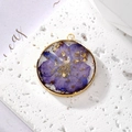 Round resin pendant with purple dried flower and gold foil in a golden metal frame - July Violet With Gold Foil