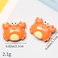 Detailed macro view showing orange resin crab dimensions 2.1cm by 1.7cm for DIY crafts - Orange Crab