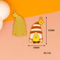 Detail view of gnome pendant charms with honeycomb motifs and 35mm height dimensions - Braided Gnome