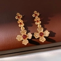 Detail of vintage gold cross earrings with amber and red crystals on leather - Silver Needle Earrings-Gold-Brown