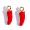 Close-up of red chili fruit pendants with gold metal rings for DIY jewelry making - Small Red Chili