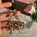 Detailed close-up of champagne crystal drop earrings with long tassels and gold finish - Champagne Water Drop