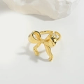 Adjustable golden bow-knot ring for women featuring a polished 3D metal design - Twisted Bowknot (JZ0521-4)