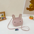 Detailed close-up of pink rabbit cartoon kid crossbody bag with leather texture - Round Pink