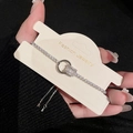 Detailed view of adjustable silver zircon pearl bracelet on a display card - 87# Bracelet - Silver - Round (real Gold Plated)