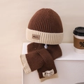 Detail of knitted winter set showing soft texture and min leather label on hat and scarf - Set / Coffee