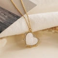 Golden heart pendant necklace with white inlay and sparkling cubic zirconia stones - White