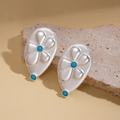 Dettaglio di orecchini a goccia in argento con perline turchesi su base in pietra - Argento (Perno in argento sterling 925)