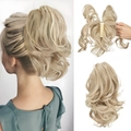 Golden wavy ponytail hair extension with a secure claw clip for natural volume - Bleach Blonde Highlights (16H613)