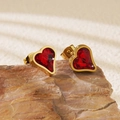 Elegant heart-shaped stud earrings in gold finish with vibrant red stones on a stone - Red Heart Stud Earrings (BD511-red)