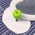 Detail of green apple hair clip with glossy resin finish and metal duckbill clip - Green Apple