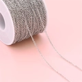 Macro shot of silver stainless steel chain on a spool for DIY jewelry making - Wire 0.3mm-Width 1mm / Steel