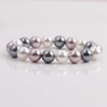 Elegant multi-colored shell pearl bracelet in white, grey and lavender tones on a clean background - White Gray Purple Tri-color Shell Pearl