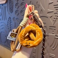 Cute plush pretzel keychain with braided strap and emotional expression on a bag charm - Plush Food-Pretzel