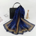 Blue silk-texture floral scarf with leopard print edge draped over a handbag - Royal Blue (Vintage Leopard Edge)