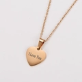 Macro detail of 18K gold plated heart necklace with I Love You engraving - Rose Gold Mom I Love You