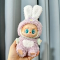 Labubu doll in purple and white plush rabbit outfit with flower head accessory - Purple Flower Rabbit Ear Headband Two-piece Set / First And Second Generation Keychains Are Compatible With La Cloth Dolls. Dolls Not Included.