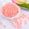 Pink frosted acrylic star beads for DIY jewelry making displayed in a white bowl - Peach Pink Frosted Star (83pcs)