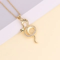 Dettaglio del ciondolo a serpente dorato con occhi verdi e zirconi incastonati lucidi - Stile Serpente con Zirconi Chiari e Occhio Verde (1#)