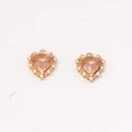 Macro shot of gold heart earrings with micro-set zircon and faceted pink-orange gemstone - 15*16mm / Champagne