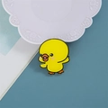 Cute yellow cartoon duck acrylic pin with orange beak on blue background for bags - Happy Duck