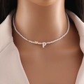 Handmade shell necklace with white beads, golden heart, and letter P pendant - Letter P