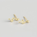 Sleek gold snake-shaped stud earrings with polished finish and minimalist design - Gold