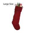 Detail of a large red knit Christmas stocking with classic cable stitch and holiday decor - Large Size Red