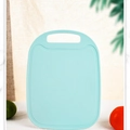Light blue plastic cutting board with anti-slip texture and hanging handle - Blue