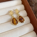 Macro view of 18K gold-plated textured metal earrings with brown tiger eye stone teardrops - Hammered Metal Teardrop Cat's Eye Style (3#)