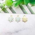 Light blue flower charm pendant with gold plating on marble surface background - 8x11mm / Light Blue