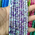 Macro shot of 3x6mm cylindrical natural stone spacer beads with blue and purple textures - Imperial Jasper 11
