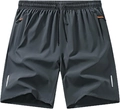 Detailansicht der schnelltrocknenden Sporthose mit dunkelgrauem Stoff und orangefarbener Tasche - S / Unterteile / Dunkelgrau