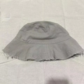 Light gray bucket hat with frayed edges made of washed canvas for casual sun protection - M (56-58cm) / Gray