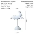 Artistic moonlight white jumping rabbit wooden ornament on a round pedestal base - Flying Little Rabbit Stand / Moonlight White