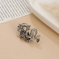 Detailed close-up of a vintage silver coiled dragon ring with intricate scale textures - Antique Silver Dragon Style 3