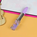 Lipstick-shaped gel pen with purple glitter liquid and star sequins on colorful background - Light Purple