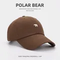 Brown cotton baseball cap featuring white polar bear embroidery and classic curved brim - Coffee