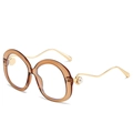 Fashionable round tea-colored sunglasses with gold wavy temples and pearl accents - Translucent Tea Frame Clear Lens