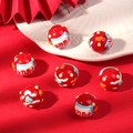 Macro detail of red ceramic beads with lucky Chinese characters for DIY jewelry - Beckoning Wealth / Red