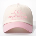 Close-up of vintage baseball cap featuring EST 1991 elk embroidery and contrast brim - Off-white and Pink