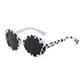 Detailed close-up of cow print round pet sunglasses with dark grey lenses and plastic frame - White Leopard/Cow Pattern Black Lens