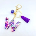 Letter W resin keychain with purple tassel, gold ring and colorful shell flake fill - Letter W