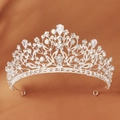 Elegant silver bridal crown with intricate leaf patterns and sparkling pear-cut crystals - TS-J2973