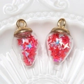 Waterdrop glass pendants with red star sequins and gold metal caps on ceramic tray - Water Drop / Watermelon red