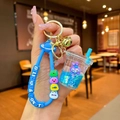 Detail of creative blue milk tea cup keychain with cartoon rabbit and liquid glitter - Blue StellaLou Milk Tea Cup