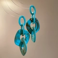 Detail of blue marble acrylic earrings on a glass stand with modern geometric rings - Steel Needle - Blue
