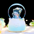 The Starry Night snow globe featuring a girl on the moon with glowing bokeh effect - Medium 80 Automatic Snow + Light + Music / 5194 Blue Starry Night Girl