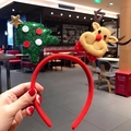 Close-up of festive Christmas headband featuring a plush reindeer and sequined green tree - Reindeer and Tree